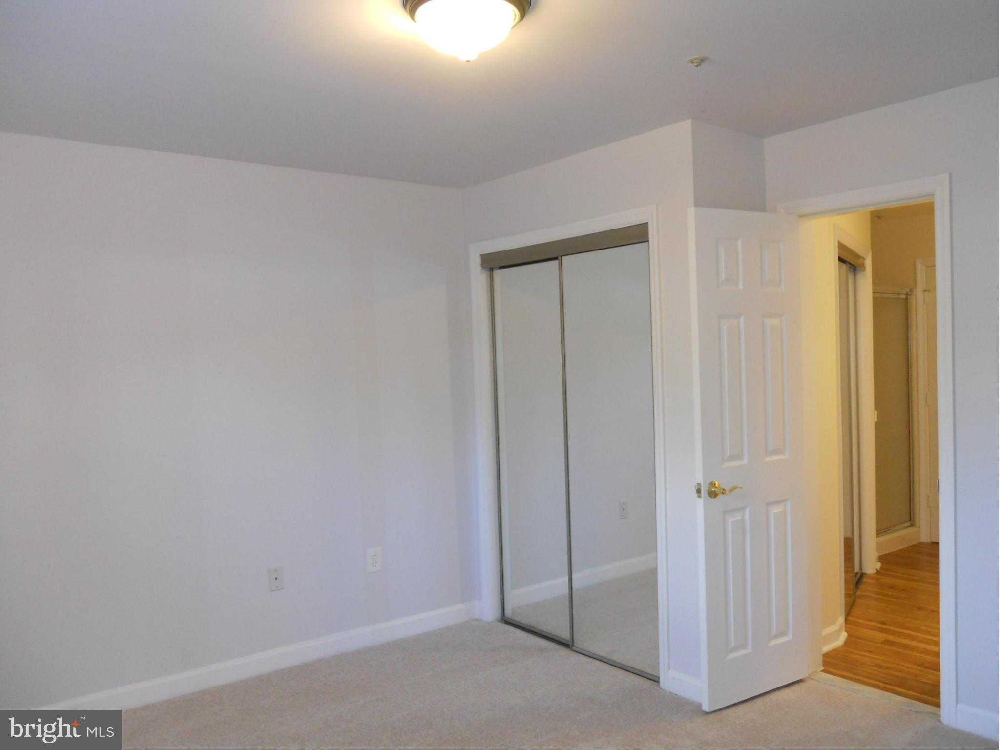 6832 Hayley Ridge Way, Unit N Baltimore, MD 21209 - Photo 20 of 30 Freshly painted second bedroom w/new carpet!