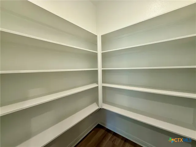 a storage room with a wooden floor