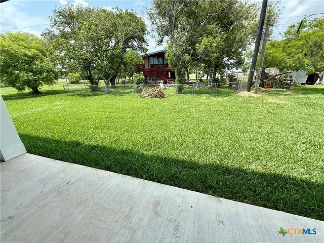a view of a park with large trees