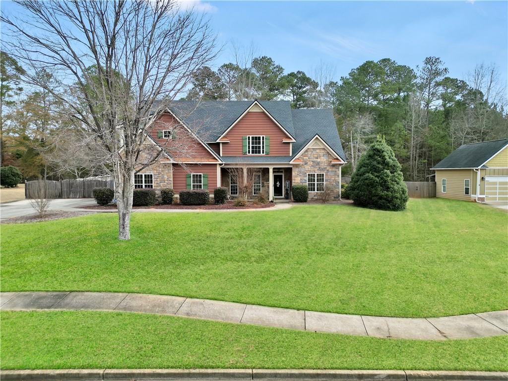 a front view of a house with a yard