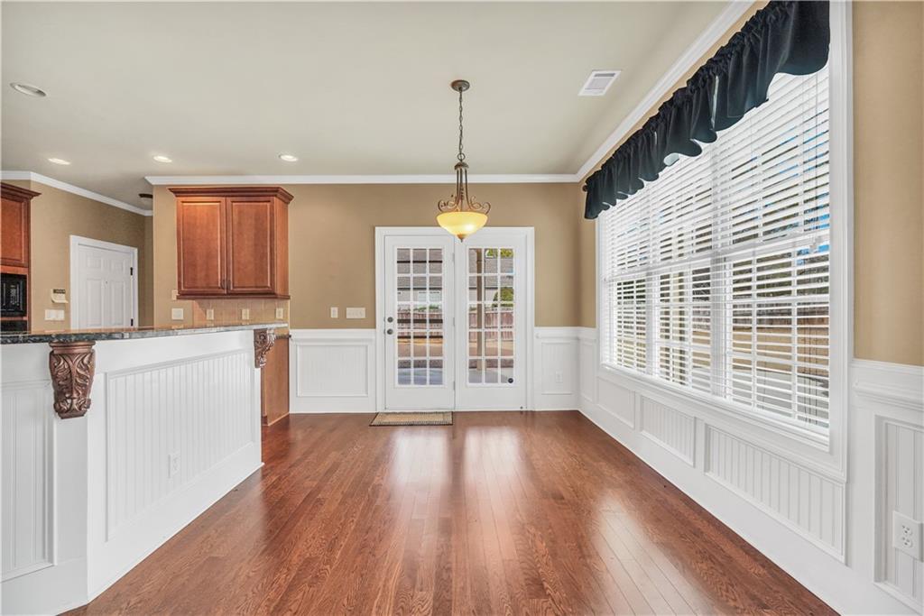 108 Caraway Road Locust Grove, GA 30248 - Photo 11 of 50 a view of a kitchen with wooden floor and a window