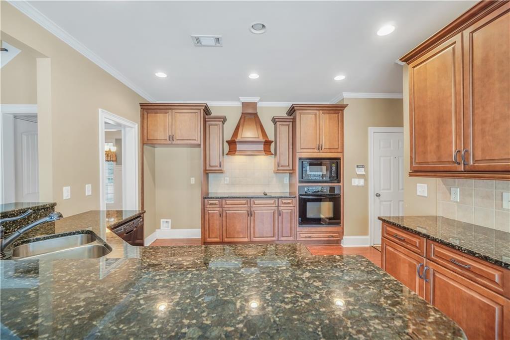 108 Caraway Road Locust Grove, GA 30248 - Photo 16 of 50 a view of a kitchen with refrigerator and windows