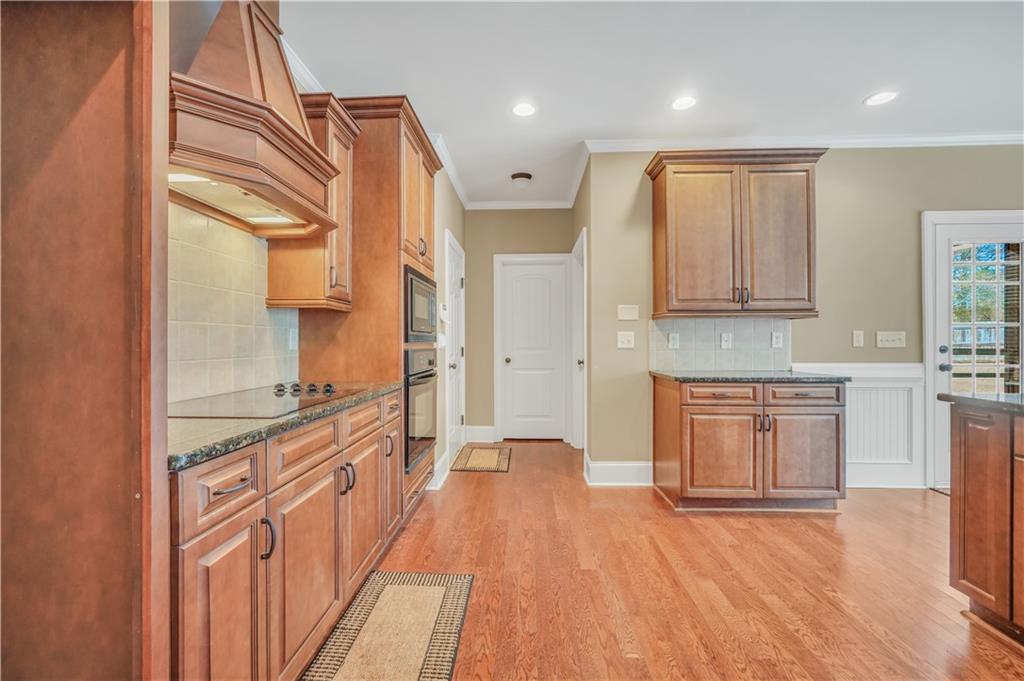 108 Caraway Road Locust Grove, GA 30248 - Photo 18 of 50 a kitchen with stainless steel appliances granite countertop a stove a sink and a refrigerator
