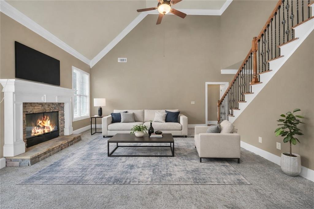 108 Caraway Road Locust Grove, GA 30248 - Photo 21 of 50 a living room with furniture and a fireplace