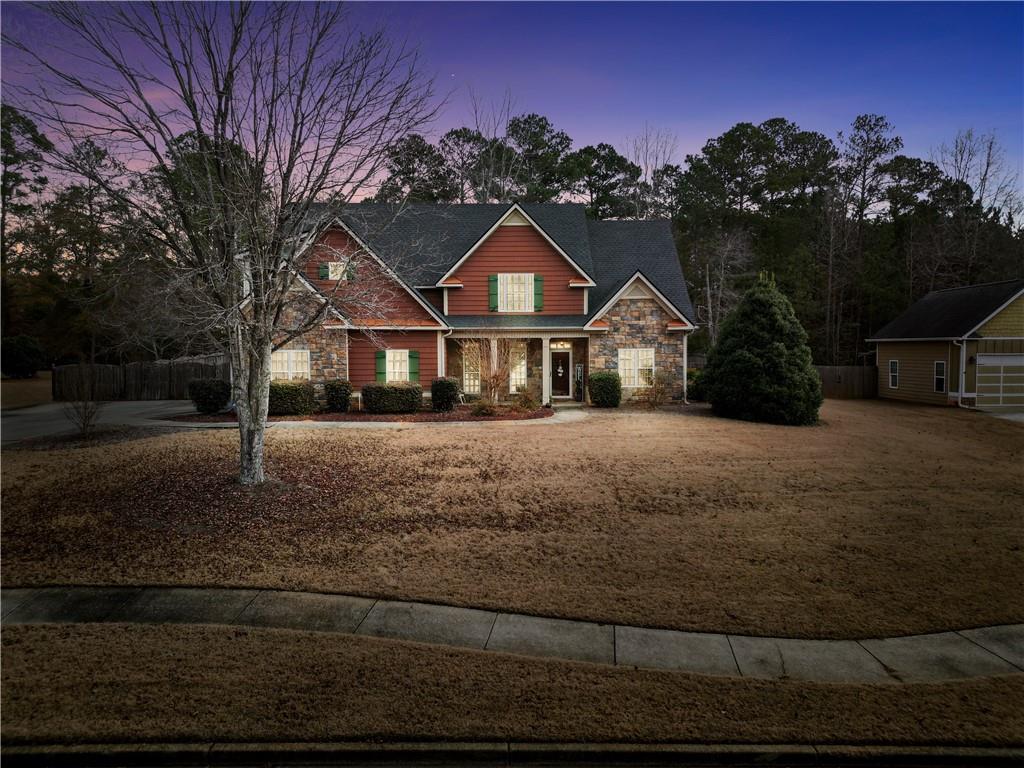 108 Caraway Road Locust Grove, GA 30248 - Photo 3 of 50 a front view of a house with a yard