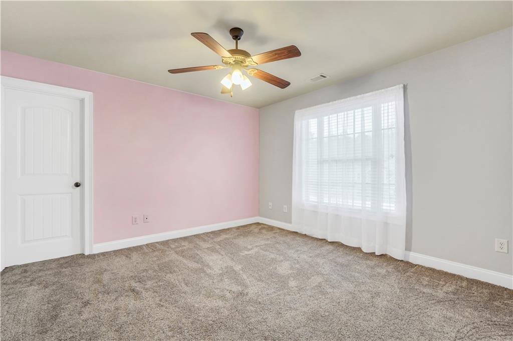 108 Caraway Road Locust Grove, GA 30248 - Photo 34 of 50 an empty room with closet and windows