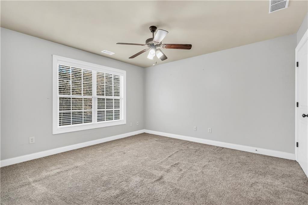 108 Caraway Road Locust Grove, GA 30248 - Photo 39 of 50 a view of an empty room with a window