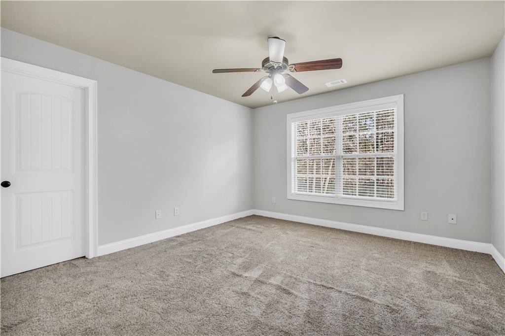 108 Caraway Road Locust Grove, GA 30248 - Photo 40 of 50 a view of an empty room with a window