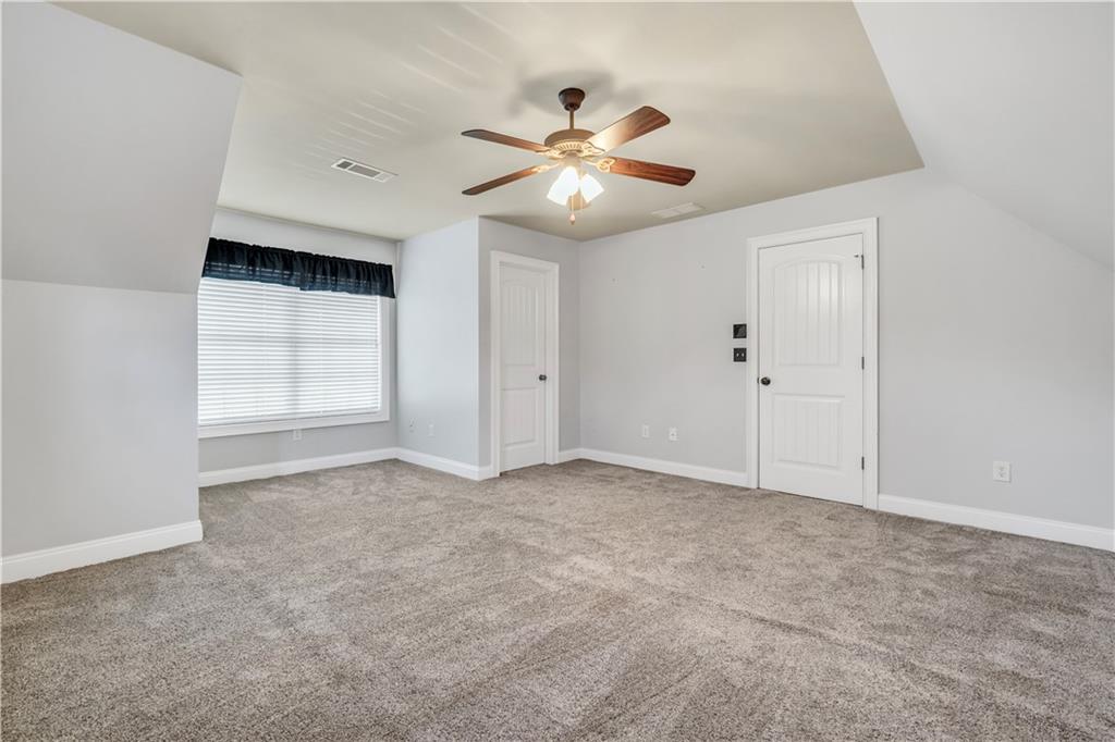 108 Caraway Road Locust Grove, GA 30248 - Photo 41 of 50 an empty room with closet and fan
