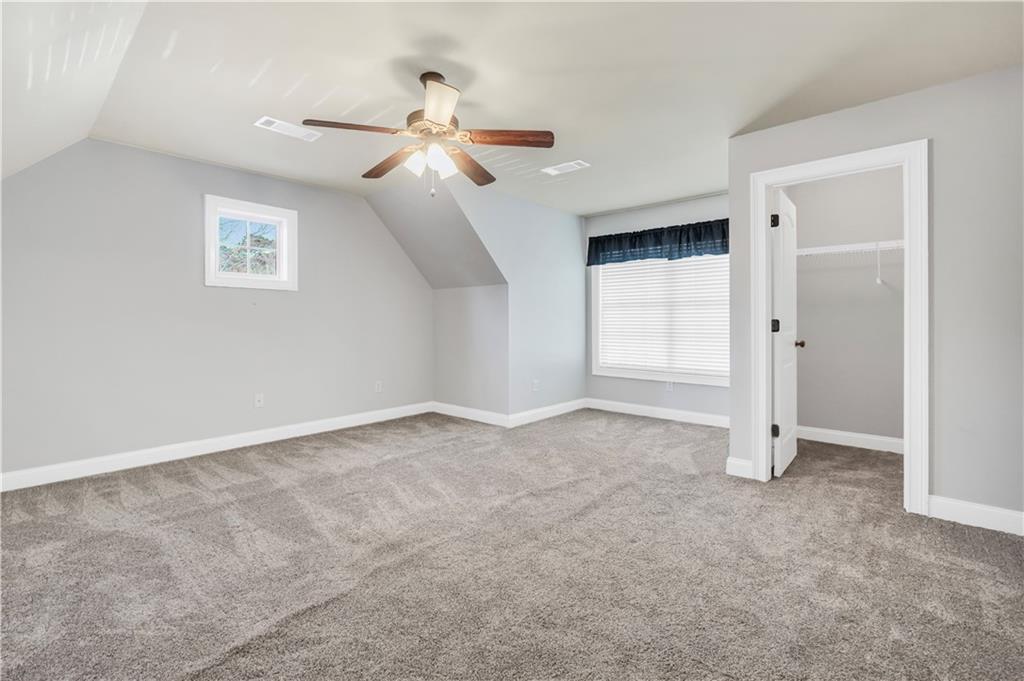 108 Caraway Road Locust Grove, GA 30248 - Photo 42 of 50 an empty room with closet and windows