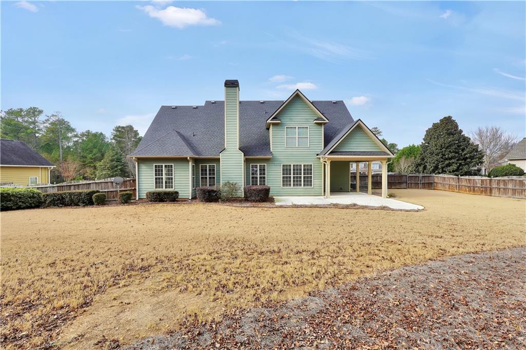 108 Caraway Road Locust Grove, GA 30248 - Photo 45 of 50 a front view of house with yard