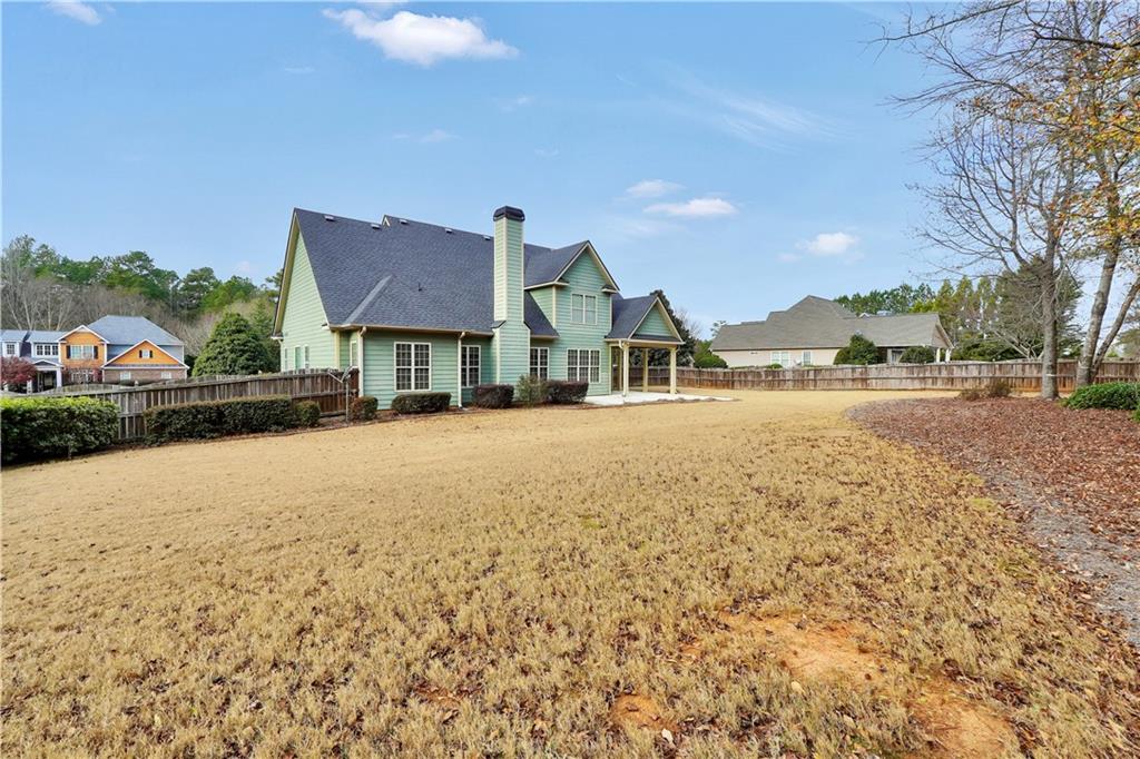 108 Caraway Road Locust Grove, GA 30248 - Photo 47 of 50 a view of house with yard