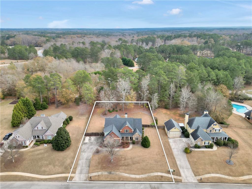 108 Caraway Road Locust Grove, GA 30248 - Photo 5 of 50 an aerial view of a house with garden view