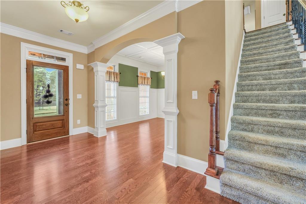 108 Caraway Road Locust Grove, GA 30248 - Photo 6 of 50 a view of an entryway with wooden floor and door