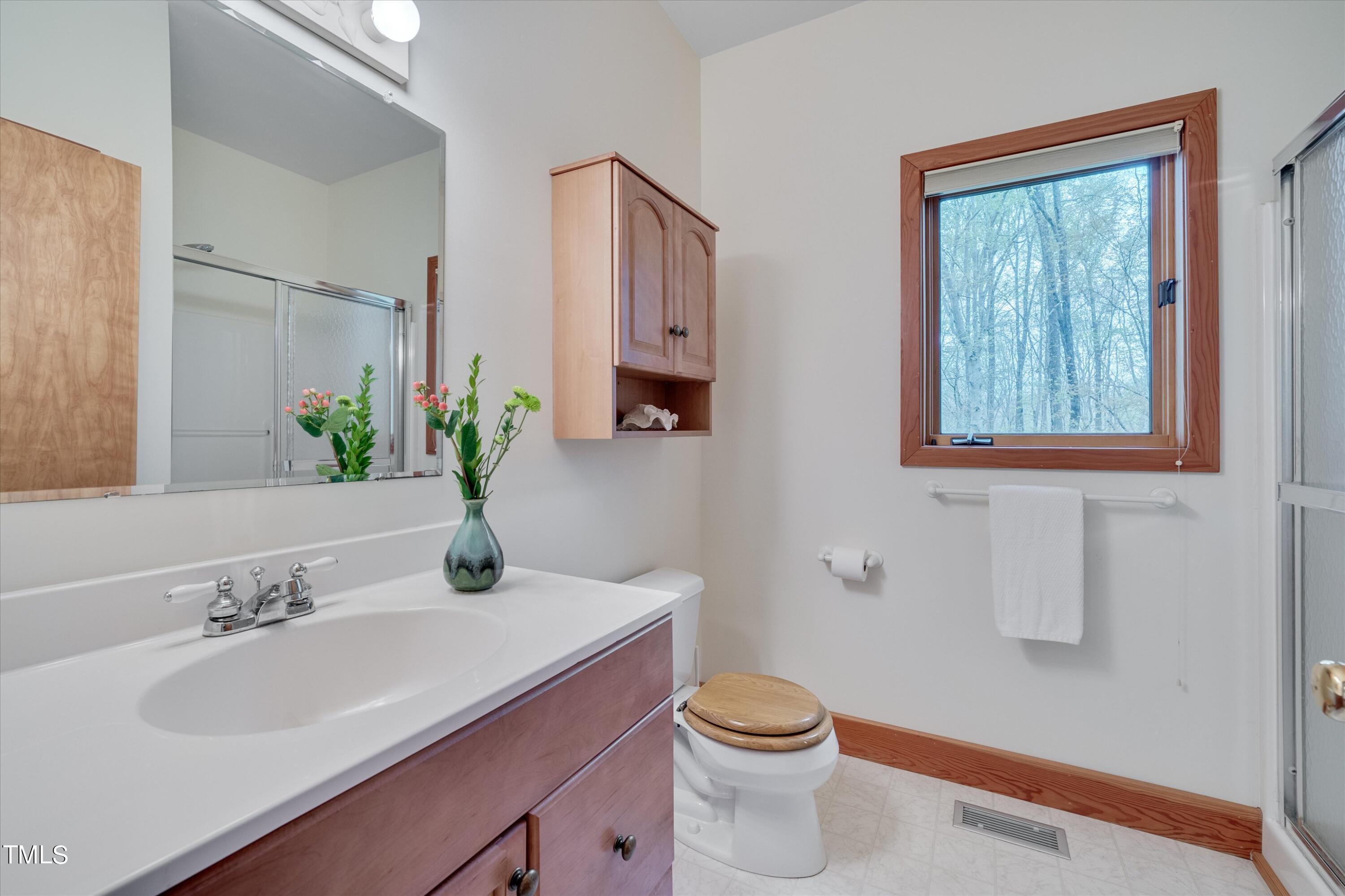 377 Potluck Farm Road Rougemont, NC 27572 - Photo 21 of 54 3/4 bathroom in the first floor primary bedroom