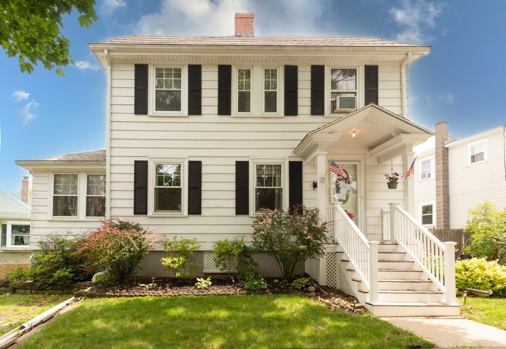 front view of a house with a yard