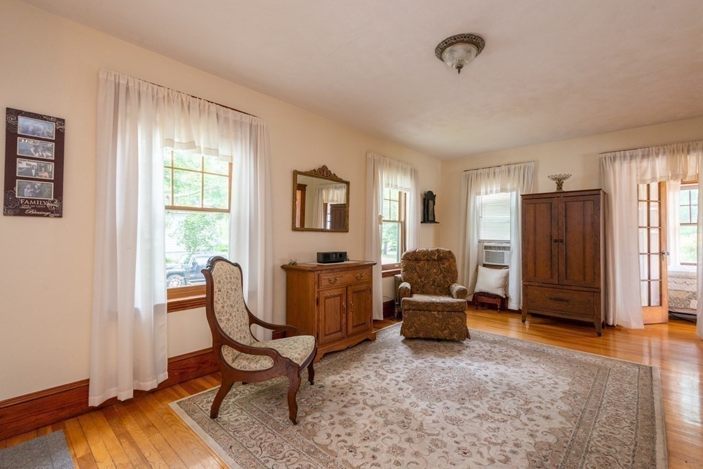 25 Porter Street Danvers, MA 01923 - Photo 12 of 42 a living room with furniture and a window