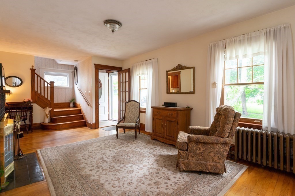 25 Porter Street Danvers, MA 01923 - Photo 13 of 42 a living room with furniture and a wooden floor