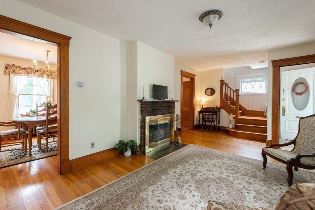 25 Porter Street Danvers, MA 01923 - Photo 14 of 42 a view of a livingroom with furniture and a fireplace