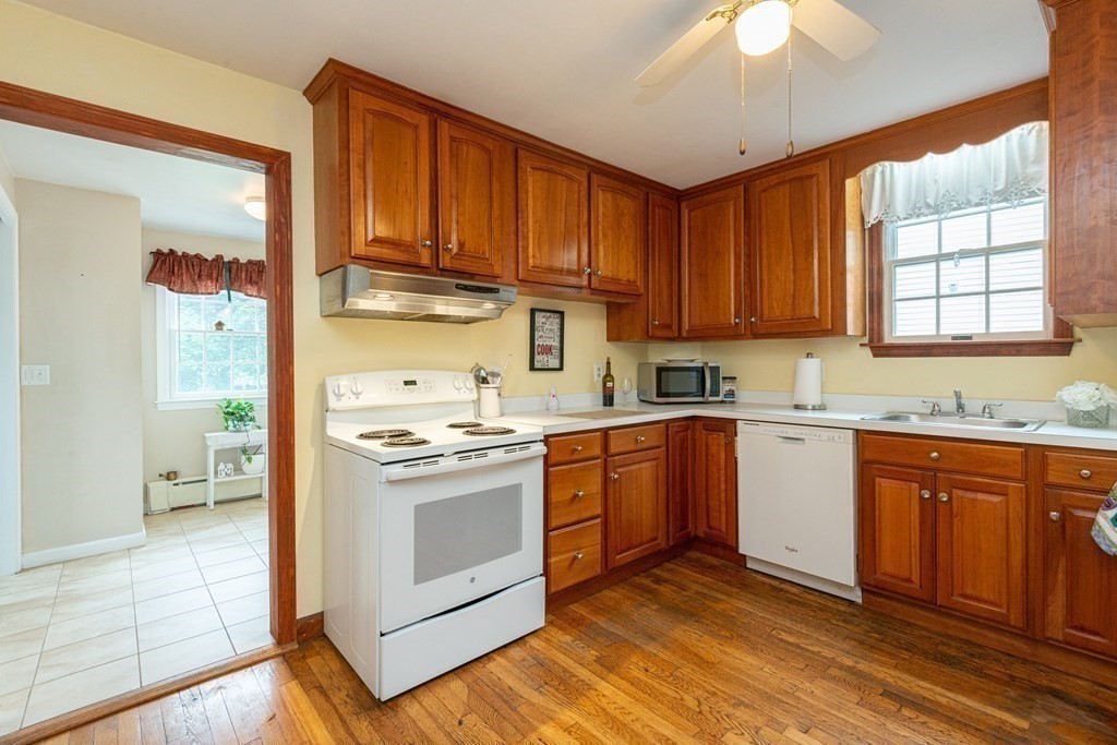 25 Porter Street Danvers, MA 01923 - Photo 19 of 42 a kitchen with stainless steel appliances granite countertop a stove a sink dishwasher and a refrigerator