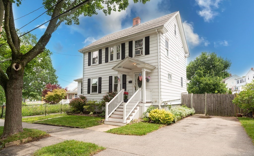 25 Porter Street Danvers, MA 01923 - Photo 2 of 42 a front view of a house with a yard and trees