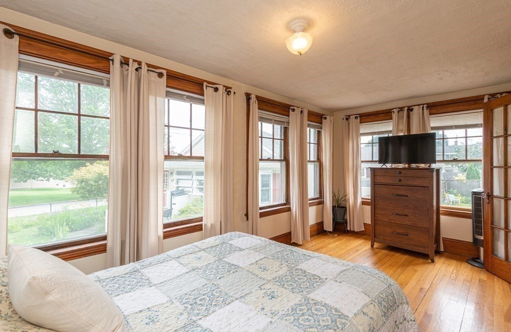 25 Porter Street Danvers, MA 01923 - Photo 24 of 42 a bedroom with a bed and large window