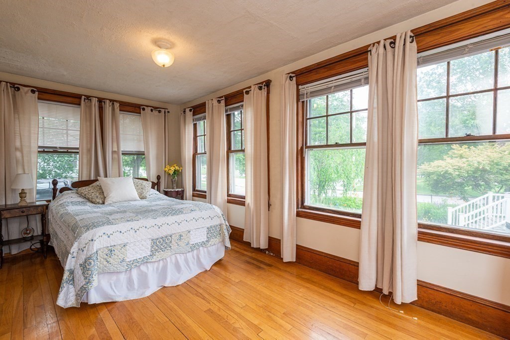 25 Porter Street Danvers, MA 01923 - Photo 25 of 42 a bedroom with a large bed and a large window