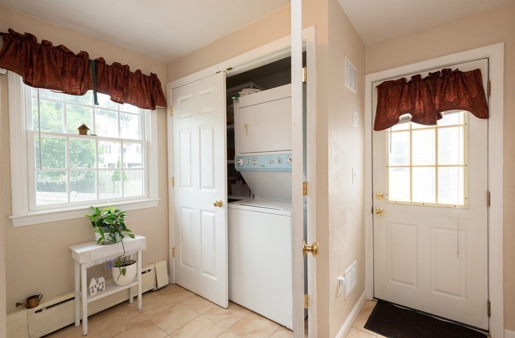 25 Porter Street Danvers, MA 01923 - Photo 27 of 42 a view of an entryway with wooden floor and windows