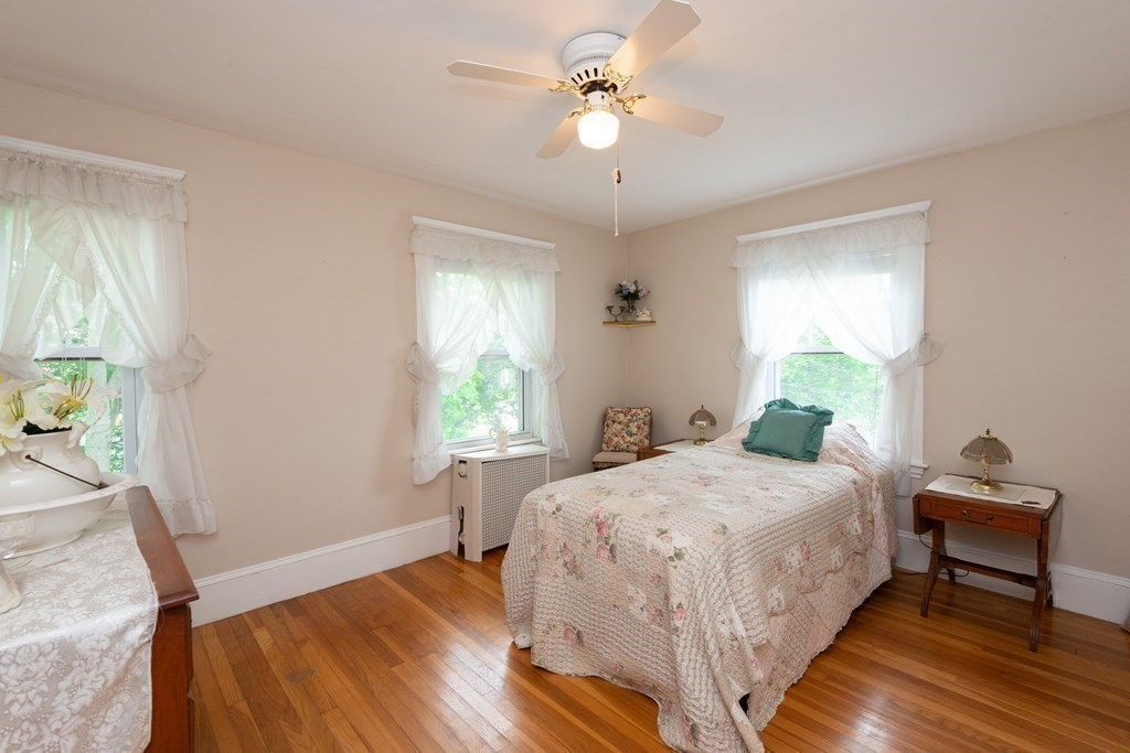 25 Porter Street Danvers, MA 01923 - Photo 33 of 42 a bedroom with a bed and a window