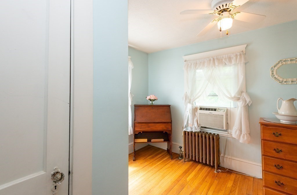 25 Porter Street Danvers, MA 01923 - Photo 35 of 42 a bedroom with a bed and a window