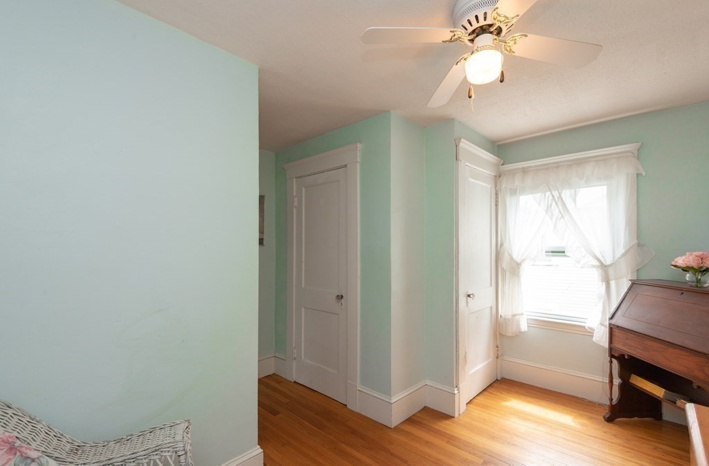 25 Porter Street Danvers, MA 01923 - Photo 36 of 42 a view of room with wooden floor and fan