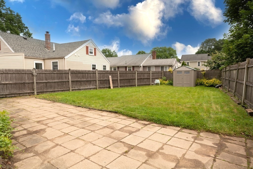 25 Porter Street Danvers, MA 01923 - Photo 4 of 42 a view of a house with a yard and sitting area