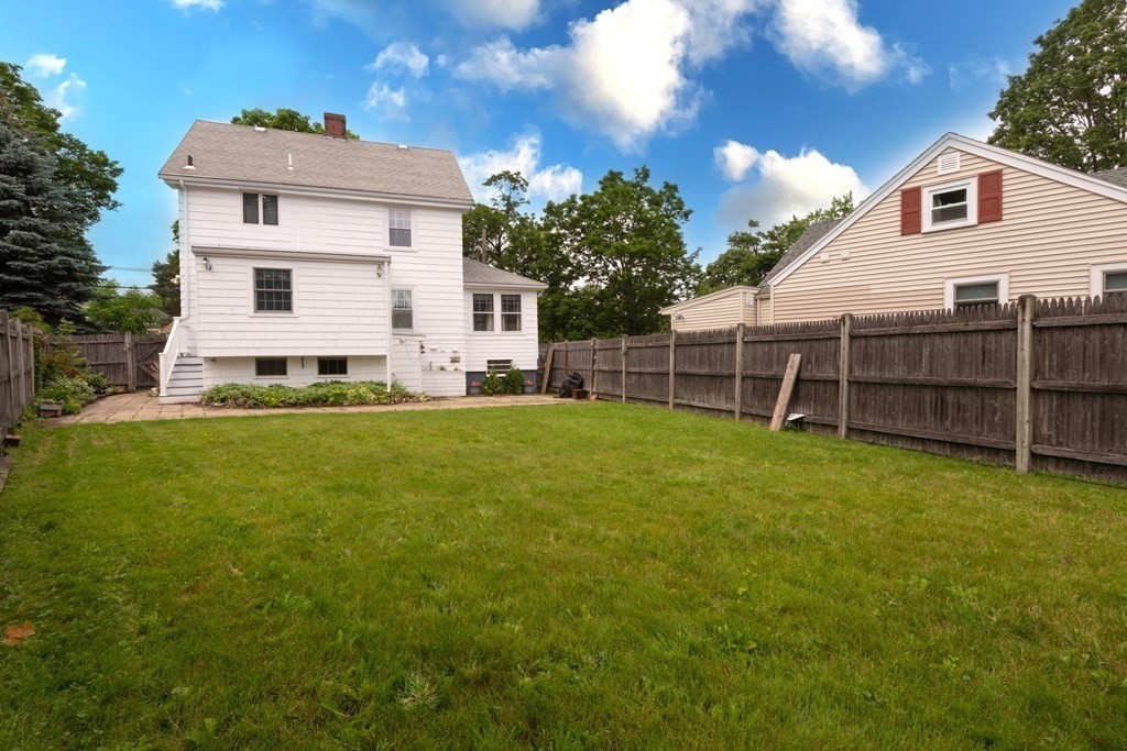 25 Porter Street Danvers, MA 01923 - Photo 5 of 42 a view of a house with a yard