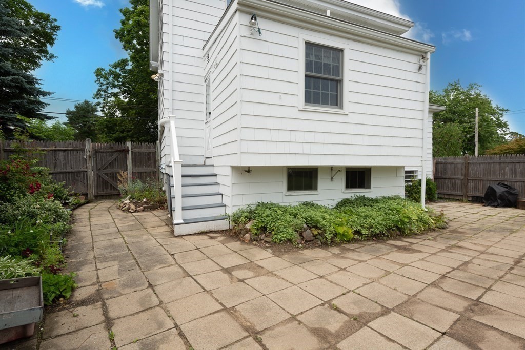 25 Porter Street Danvers, MA 01923 - Photo 7 of 42 a view of a house with a yard