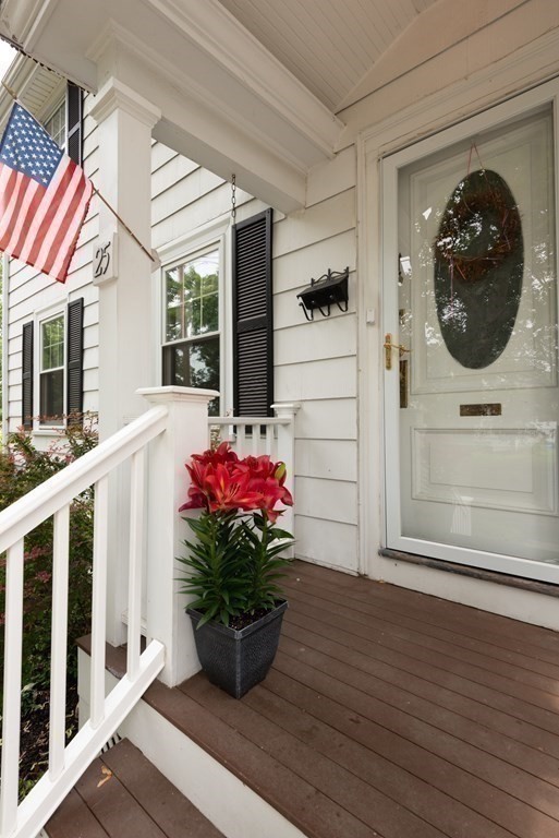 25 Porter Street Danvers, MA 01923 - Photo 9 of 42 a front view of a house with wooden floor and a potted plant