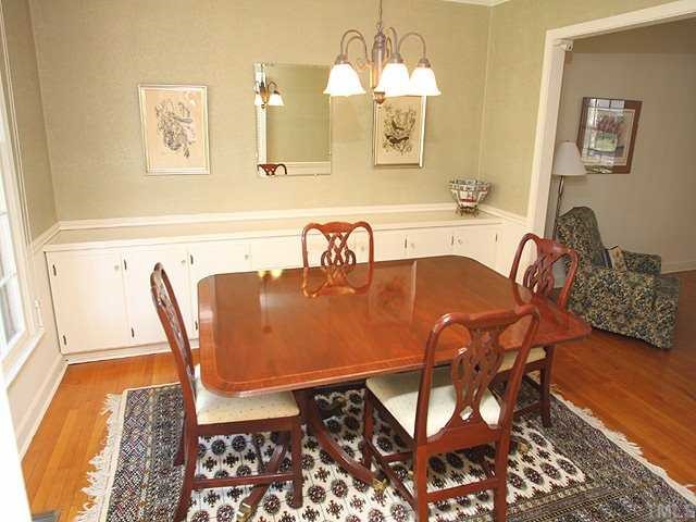 1007 Country Ridge Drive Raleigh, NC 27609 - Photo 3 of 14 a dining room with furniture and wooden floor