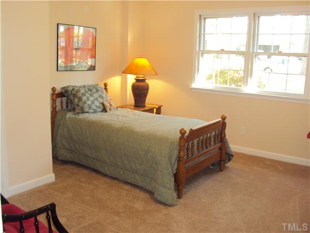 1007 Country Ridge Drive Raleigh, NC 27609 - Photo 9 of 14 a bedroom with a bed and a window