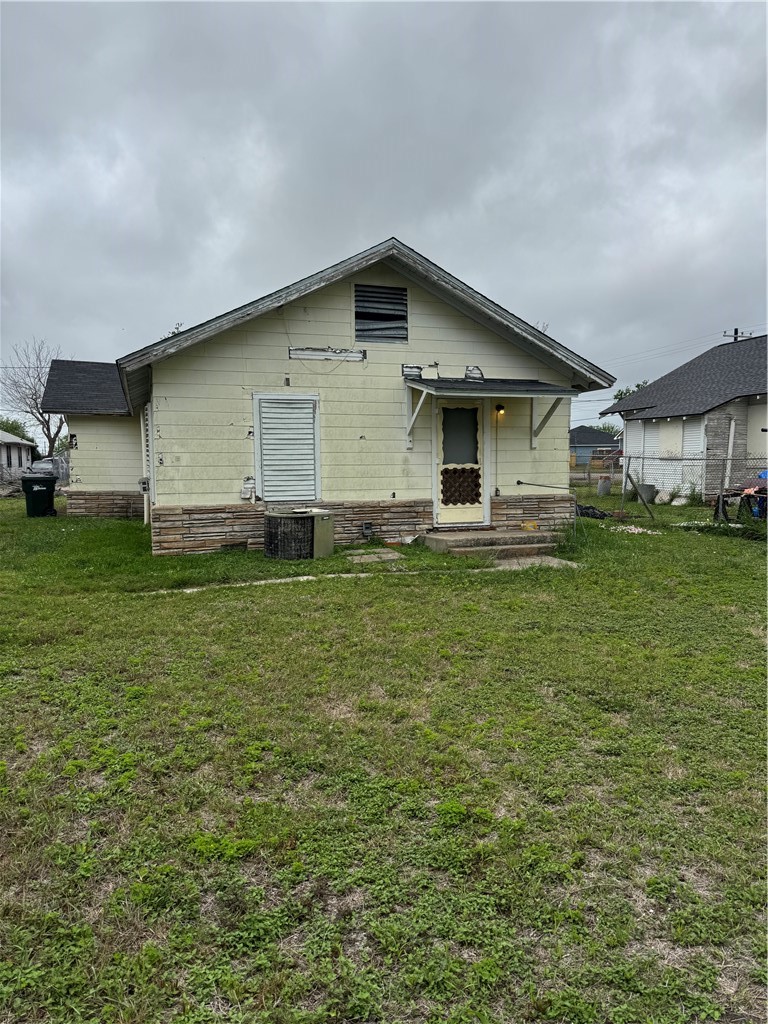 406 Mathis Street Taft, TX 78390 - Photo 3 of 7 a big white house with a yard and fence