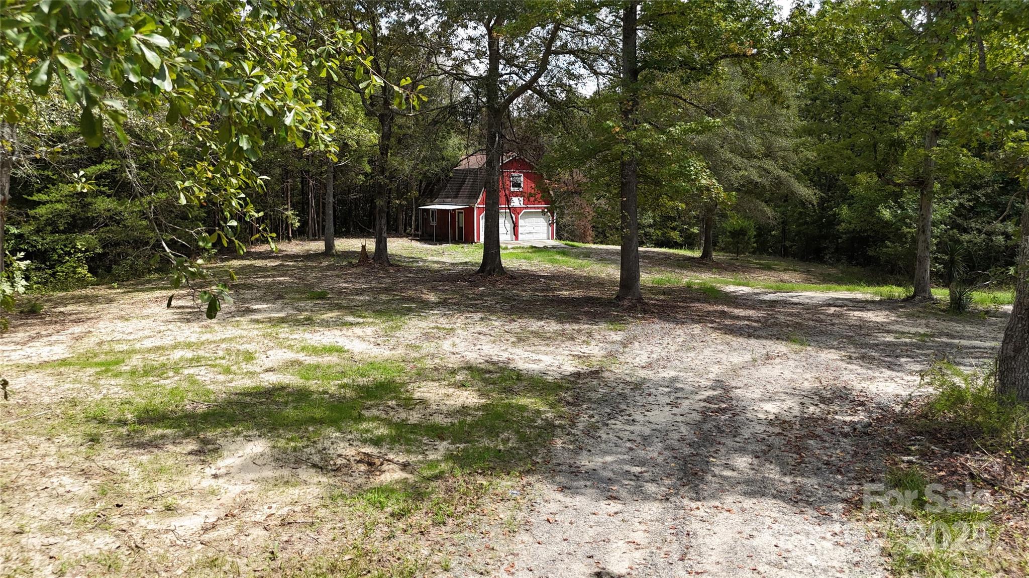 4817 Blade Run Road Edgemoor, SC 29712 - Photo 11 of 15 a backyard of a house with lots of green space