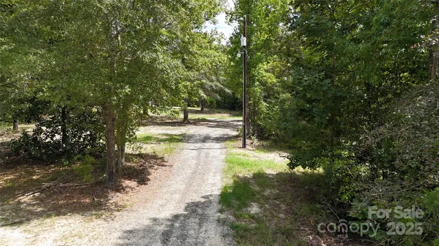 a view of a lake view with houses in back