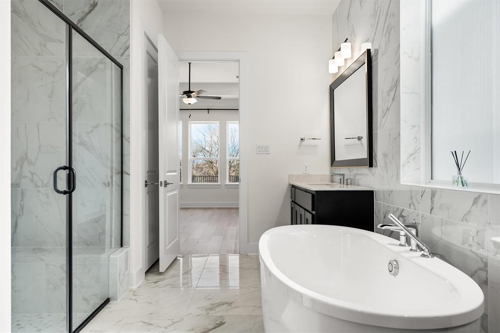 1161 Rochester Place Copper Canyon, TX 75077 - Photo 30 of 39 The spa-inspired Primary Bath features a soaking tub, separate shower, dual vanities & an expansive walk-in closet.