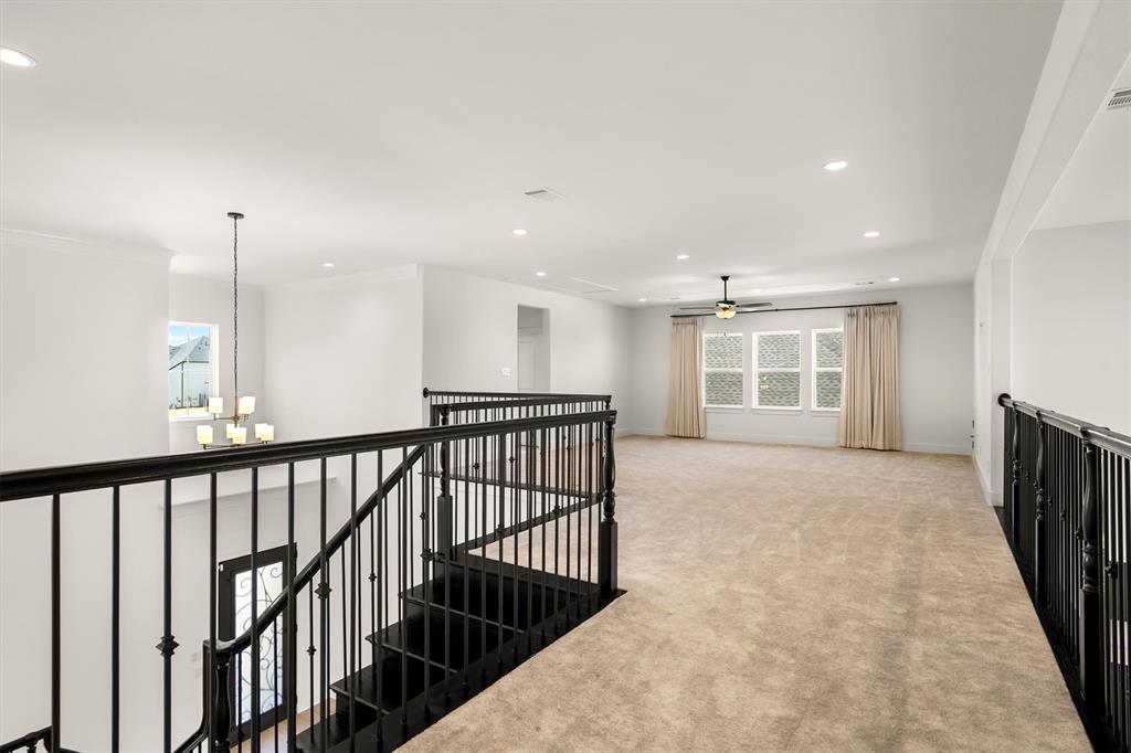 1161 Rochester Place Copper Canyon, TX 75077 - Photo 33 of 39 Stepping upstairs you'll find the MASSIVE game room with plenty of space to gather or play.