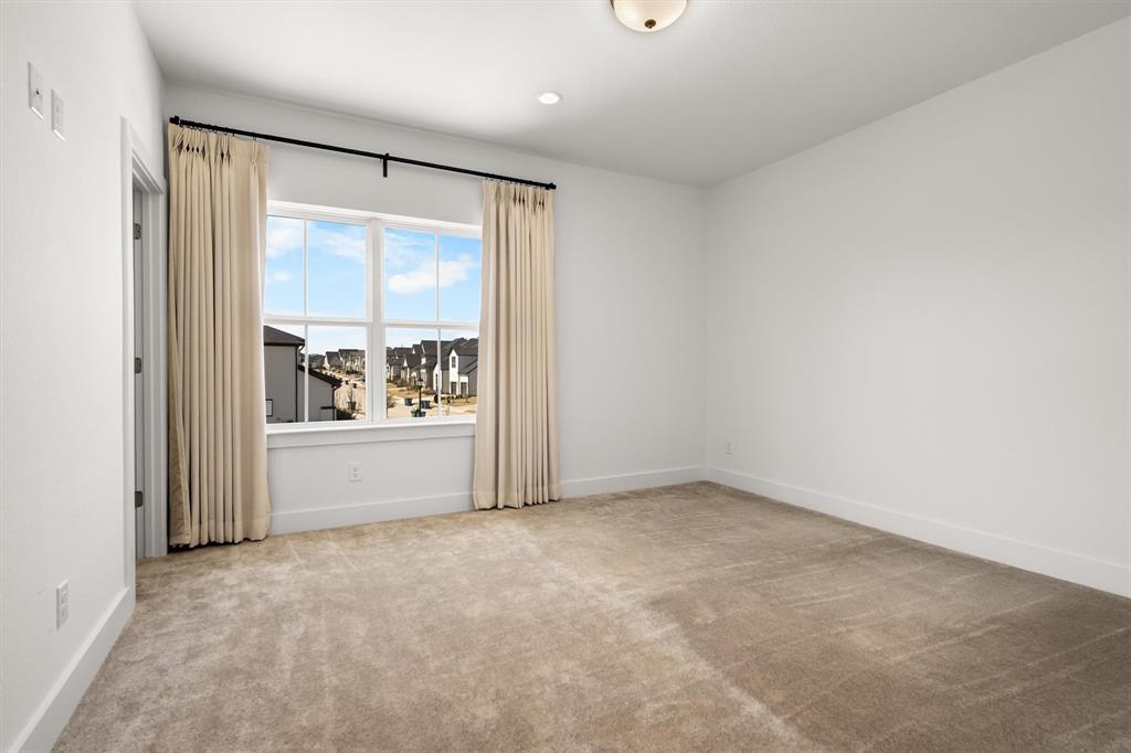 1161 Rochester Place Copper Canyon, TX 75077 - Photo 34 of 39 Bedroom #3 is upstairs and has a large walk-in closet + an ensuite bath that also opens to the hallway.