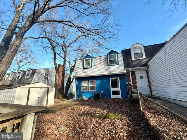 a front view of a house with parking space