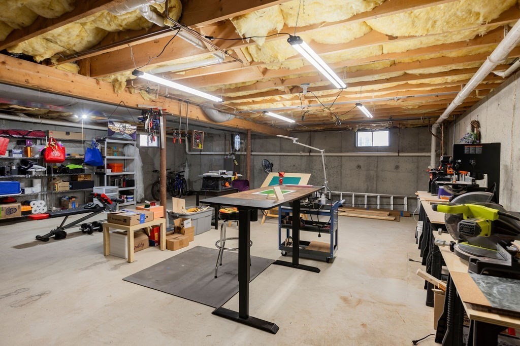126 Lafayette Street Marblehead, MA 01945 - Photo 25 of 30 a view of a garage with a table and chairs