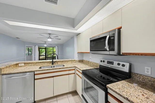 a kitchen with a stove and a sink