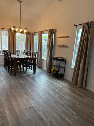 a view of a room with furniture and window