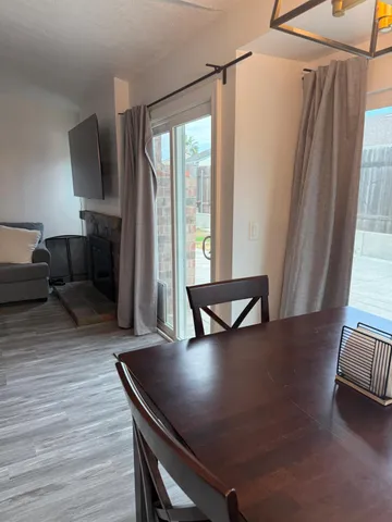 a view of a living room with furniture and a window