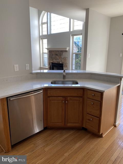 5128 Barness Court Doylestown, PA 18902 - Photo 14 of 27 a kitchen with granite countertop a sink and wooden cabinets