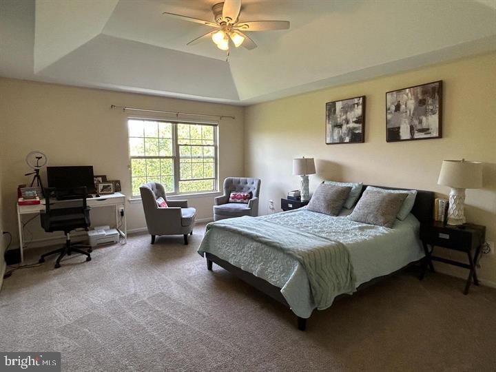 5128 Barness Court Doylestown, PA 18902 - Photo 16 of 27 a spacious bedroom with a bed and a couch